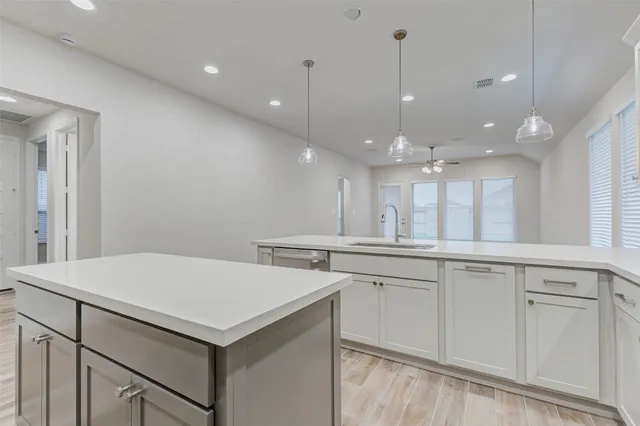 a kitchen with a sink and cabinets