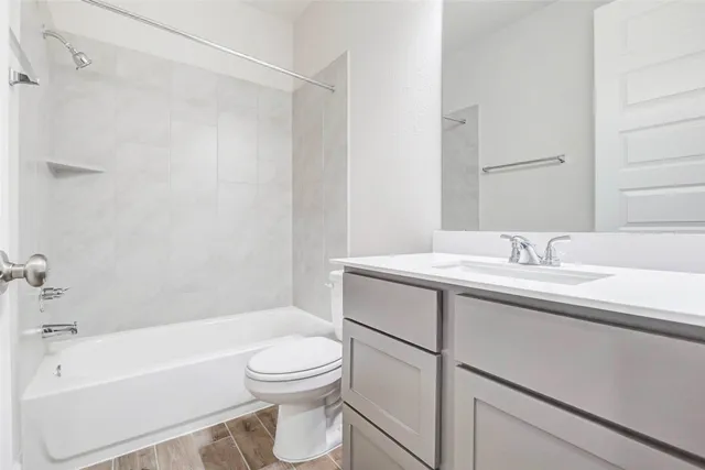 a bathroom with a sink a toilet and a bathtub