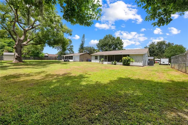 a view of a city with lush green forest