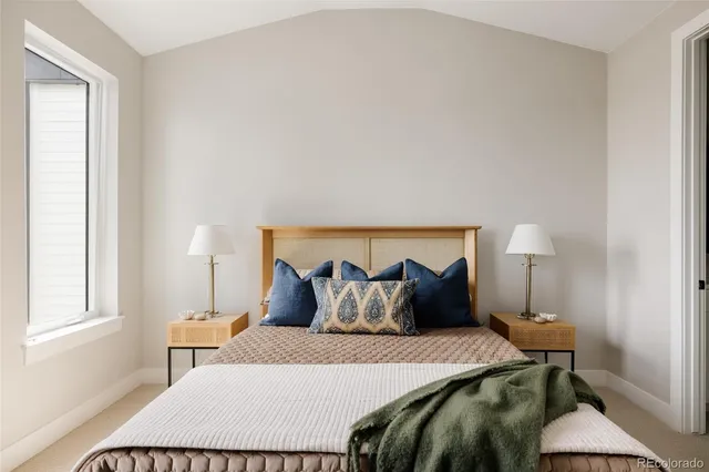 a bedroom with a bed and a walk in closet