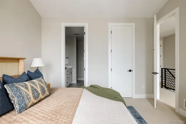 a bathroom with double vanity sink and a mirror