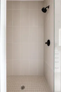 a bathroom with a sink a stove and a mirror