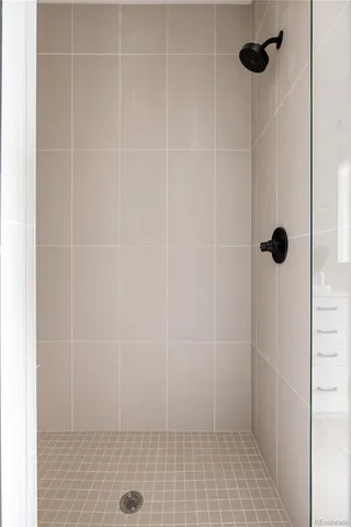 a bathroom with a sink a stove and a mirror