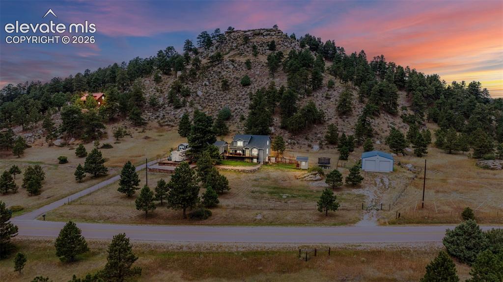17370 Sweet Road Peyton, CO 80831 - Photo 5 of 38 Aerial view at dusk of this gorgeous Peyton Pines gem where quiet and tranquility are just minutes from everything you need.