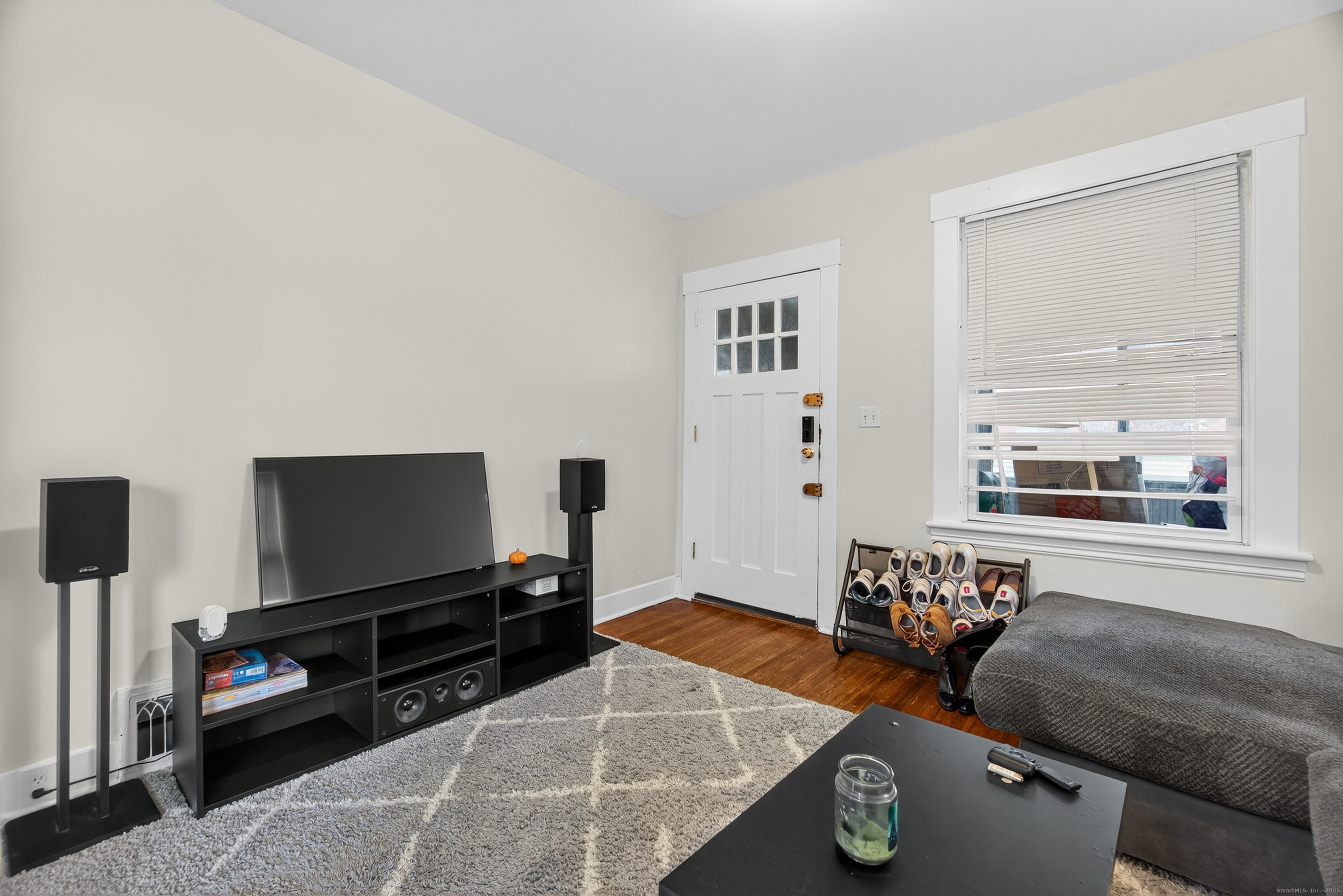 215 Overland Avenue Bridgeport, CT 06606 - Photo 5 of 32 a living room with furniture and a flat screen tv