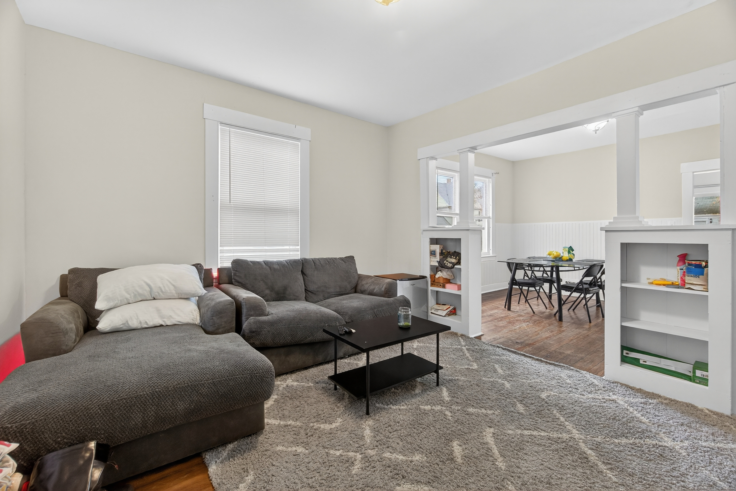 215 Overland Avenue Bridgeport, CT 06606 - Photo 6 of 32 a living room with furniture and a fireplace