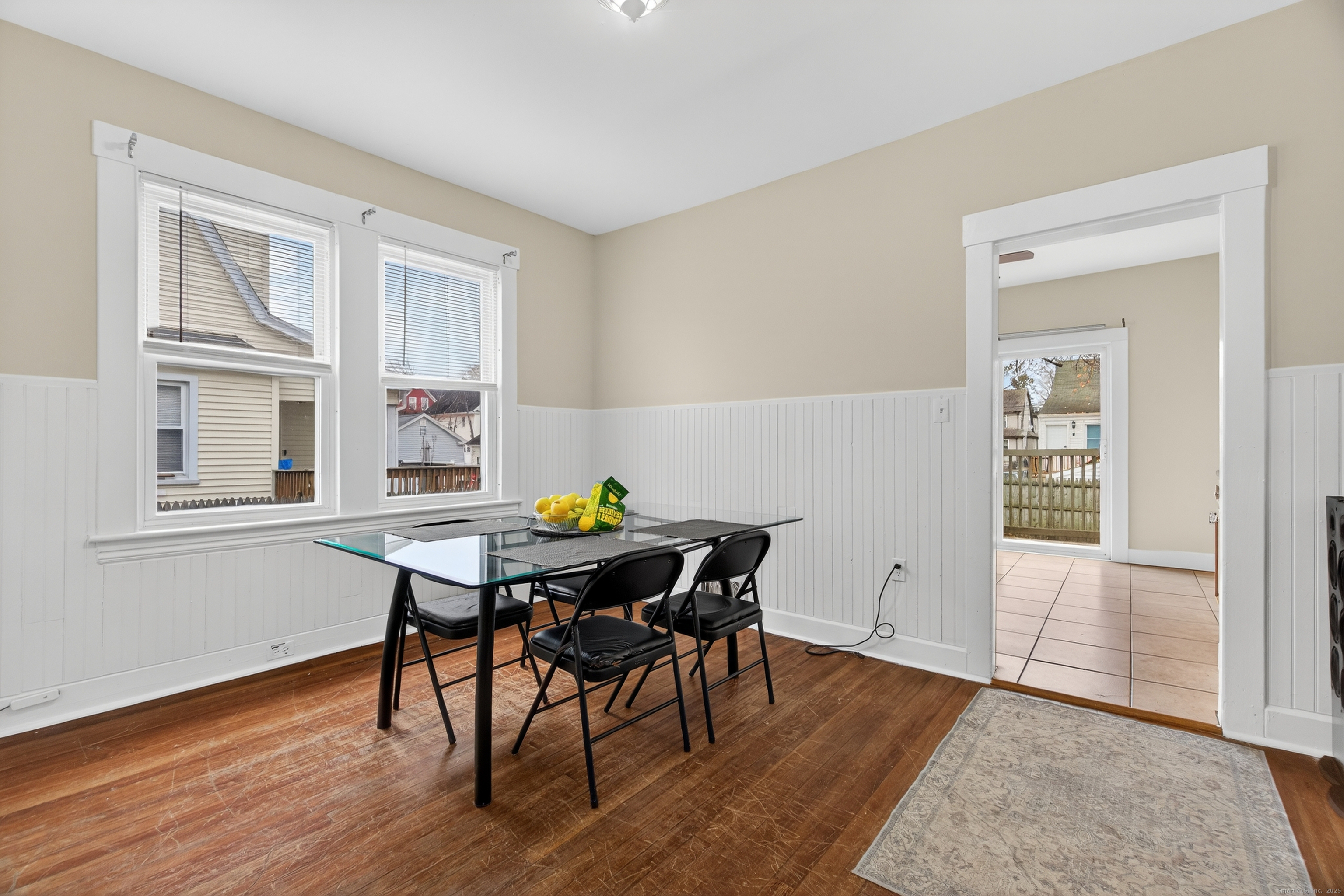 215 Overland Avenue Bridgeport, CT 06606 - Photo 8 of 32 a view of a dining room with furniture and wooden floor