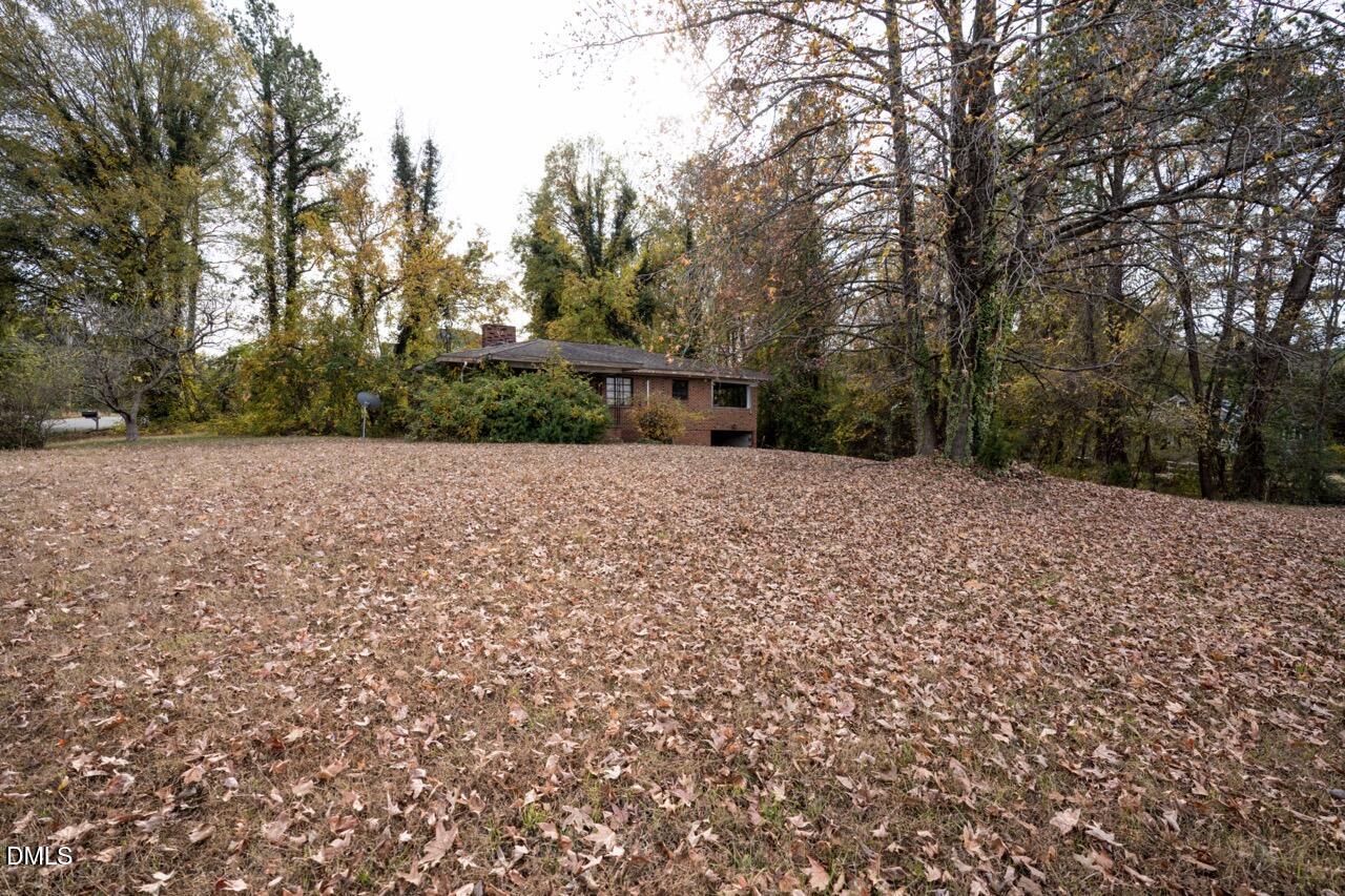 2328 Cheek Road Durham, NC 27704 - Photo 3 of 7 a view of a house with a yard