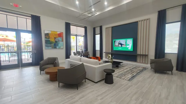 a swimming pool with outdoor seating and city view