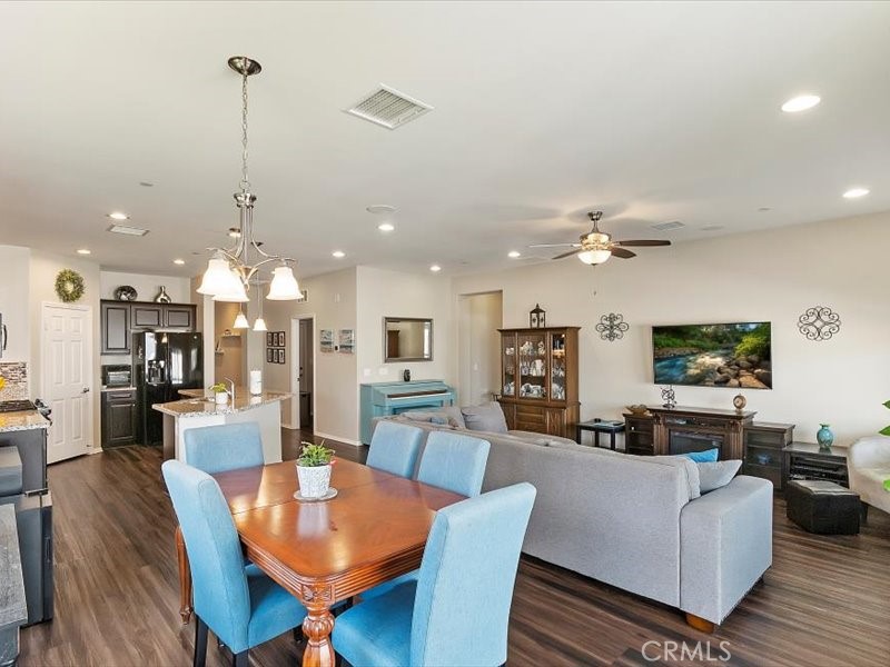 1580 Williamson Park Beaumont, CA 92223 - Photo 21 of 48 a living room with furniture kitchen and a chandelier