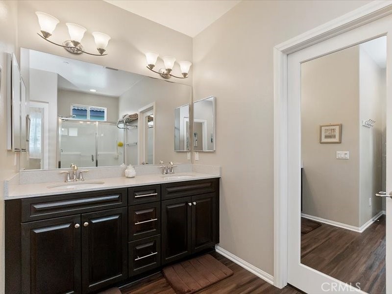 1580 Williamson Park Beaumont, CA 92223 - Photo 26 of 48 a bathroom with a double vanity sink and a mirror
