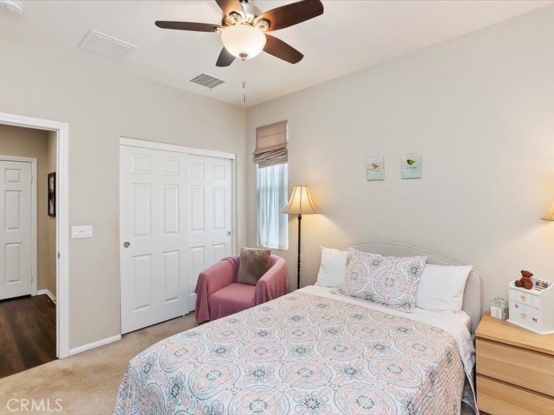 1580 Williamson Park Beaumont, CA 92223 - Photo 29 of 48 a bedroom with a bed and closet