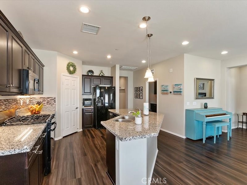 1580 Williamson Park Beaumont, CA 92223 - Photo 9 of 48 a kitchen with a table and chairs