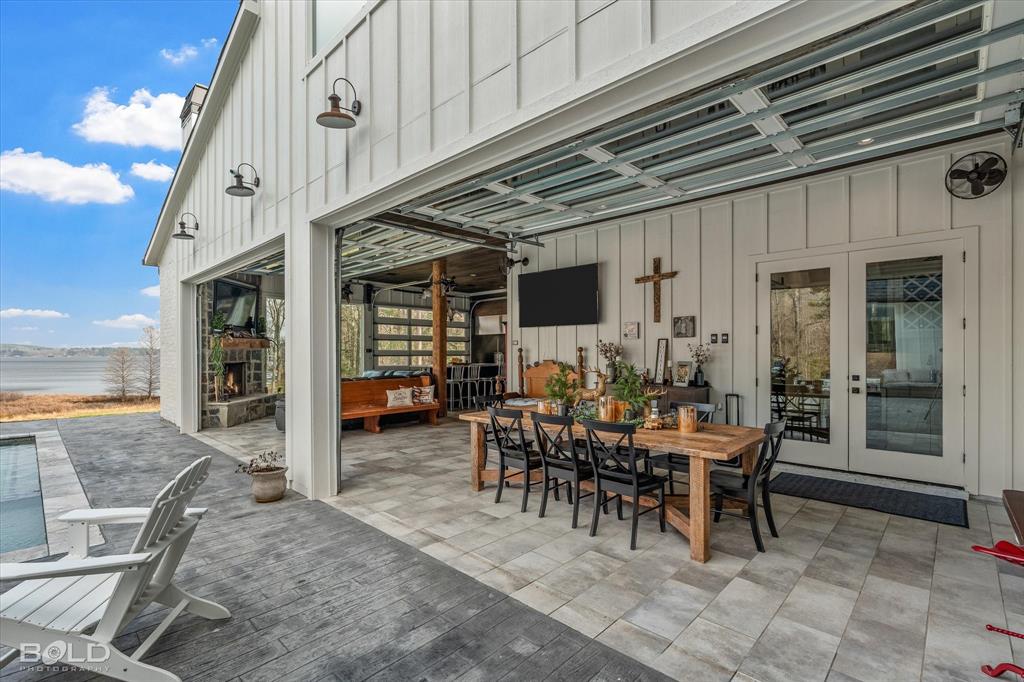 5296 Linton Cutoff Road Benton, LA 71006 - Photo 12 of 40 View of patio featuring outdoor dining area and french doors
