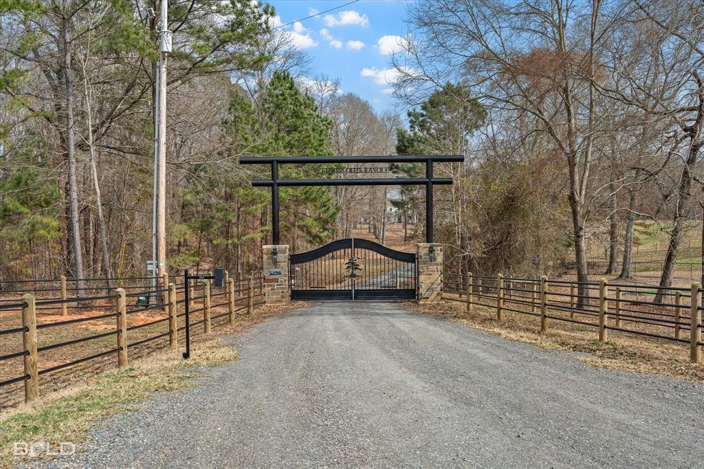 5296 Linton Cutoff Road Benton, LA 71006 - Photo 14 of 40 View of street with a gate and a gated entry