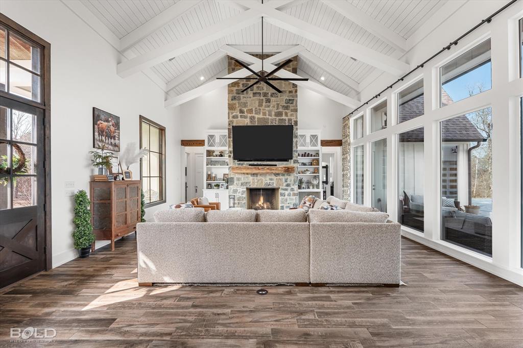 5296 Linton Cutoff Road Benton, LA 71006 - Photo 16 of 40 Living room featuring a fireplace, dark wood-style flooring, and ceiling fan
