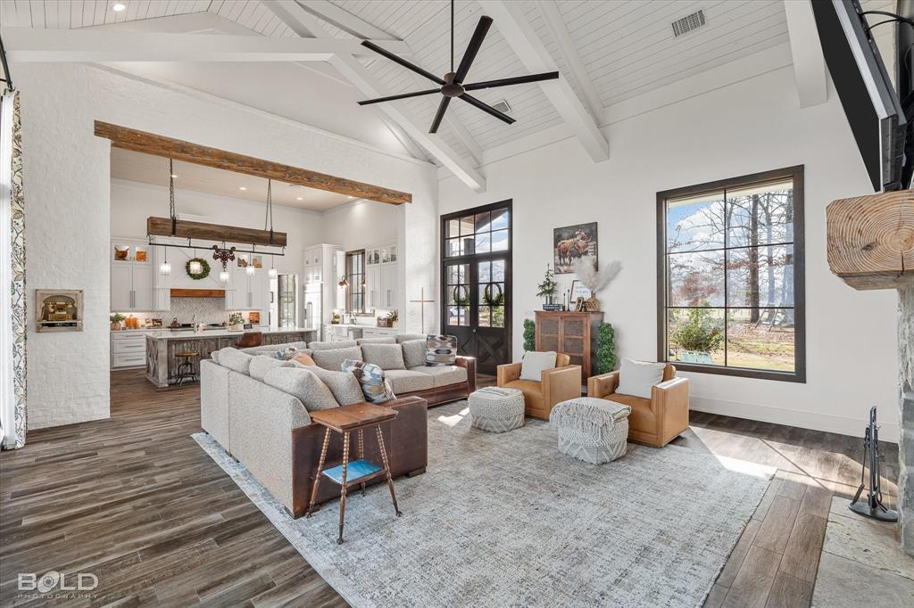 5296 Linton Cutoff Road Benton, LA 71006 - Photo 17 of 40 Living room with a ceiling fan, dark wood-style flooring, and healthy amount of natural light