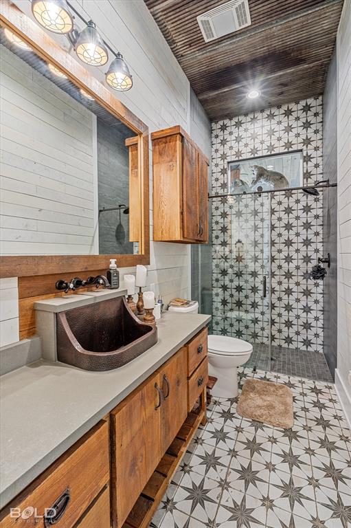 5296 Linton Cutoff Road Benton, LA 71006 - Photo 32 of 40 Bathroom featuring vanity, a shower stall, and tile walls