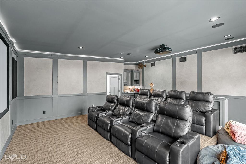 5296 Linton Cutoff Road Benton, LA 71006 - Photo 34 of 40 Carpeted cinema with a decorative wall, wainscoting, and recessed lighting