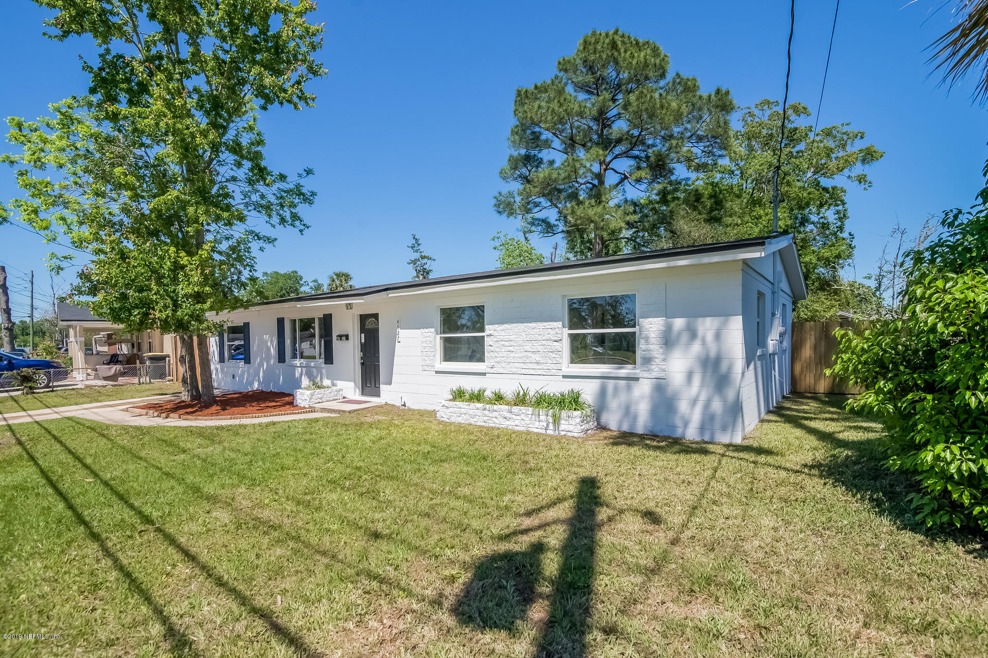 4527 Barnes Road South Jacksonville, FL 32207 - Photo 23 of 25 a house view with a sitting space and garden