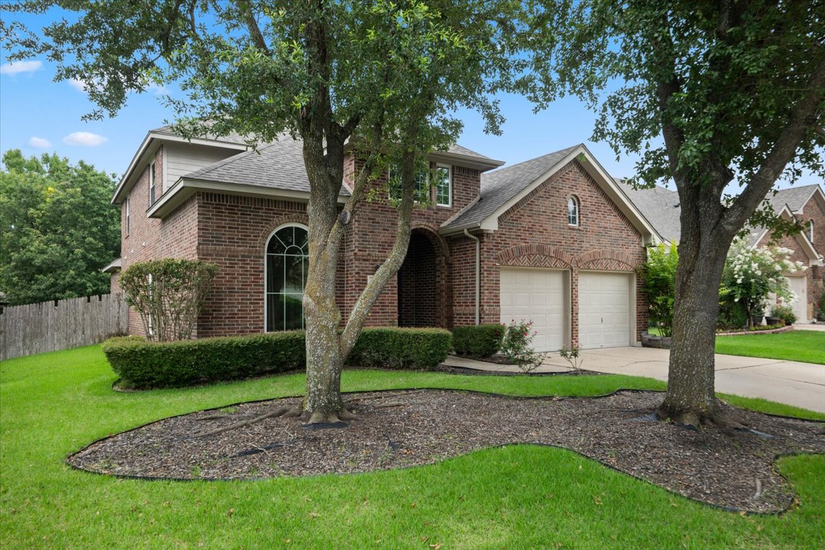 2304 Village View Loop Pflugerville, TX 78660 - Photo 3 of 40 A classic brick facade welcomes with a curved entryway and attached two-car garage.