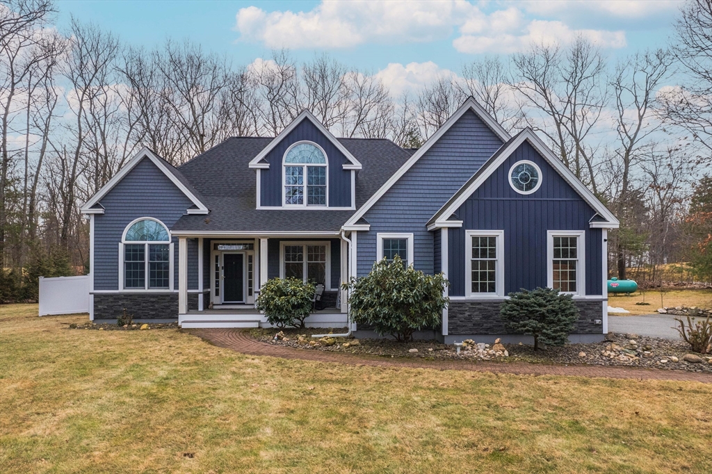 a front view of a house with yard