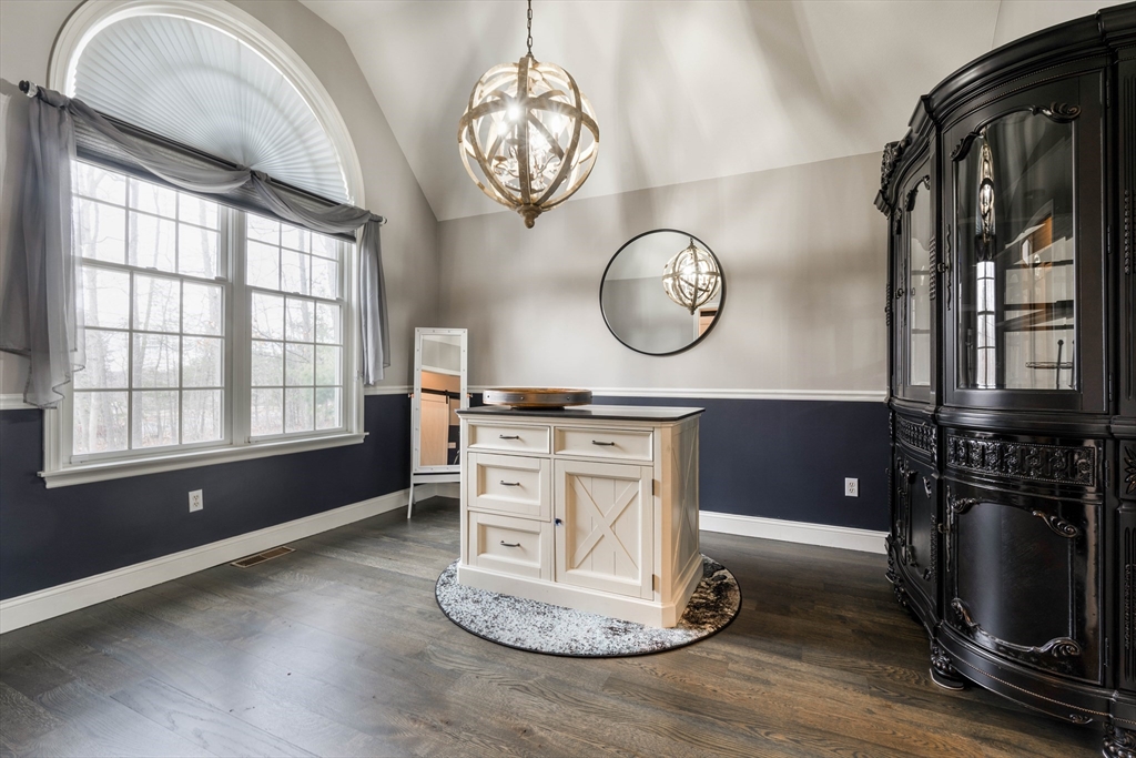 11 Pope Road Atkinson, NH 03811 - Photo 12 of 42 a kitchen with a large window and a clock on the wall