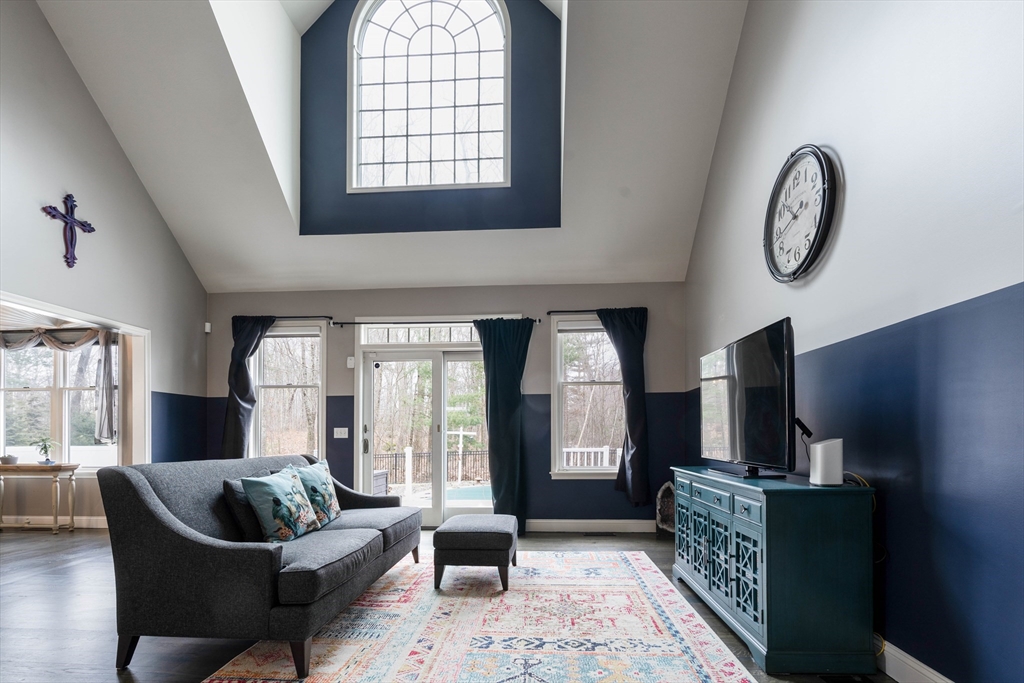 11 Pope Road Atkinson, NH 03811 - Photo 19 of 42 a living room with furniture and a large window