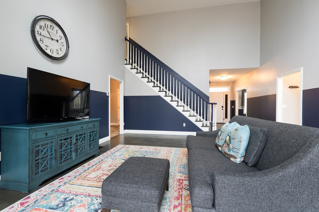 11 Pope Road Atkinson, NH 03811 - Photo 21 of 42 a living room with furniture and a flat screen tv