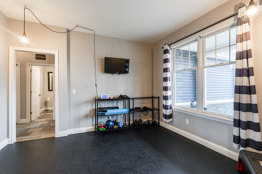 11 Pope Road Atkinson, NH 03811 - Photo 22 of 42 a view of a livingroom with lounge chair and a window