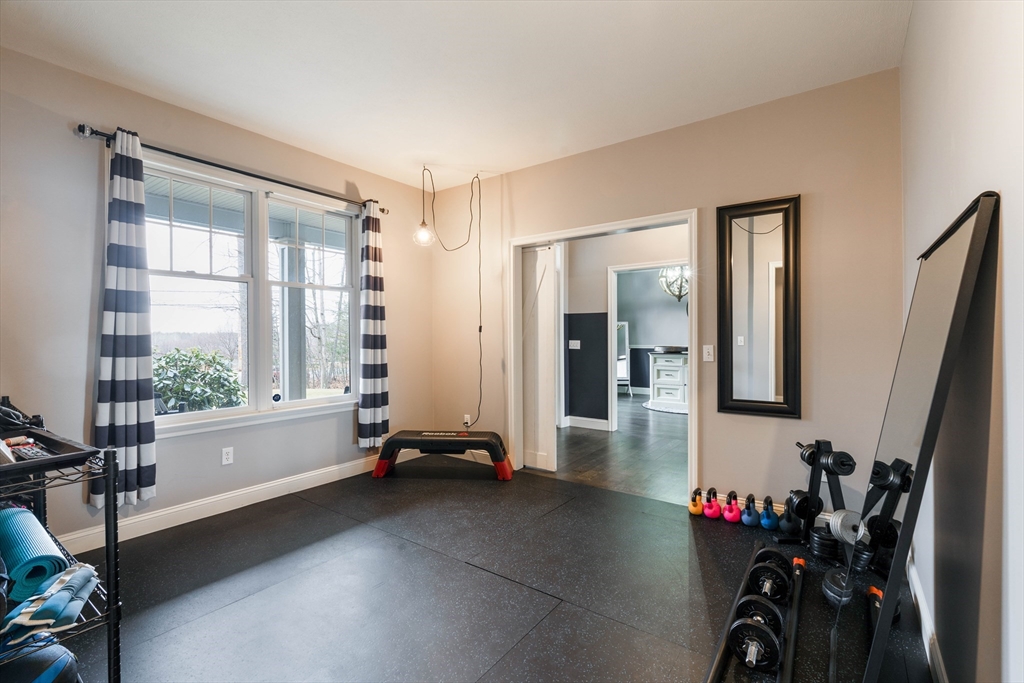 11 Pope Road Atkinson, NH 03811 - Photo 23 of 42 a room with gym equipment and a large window