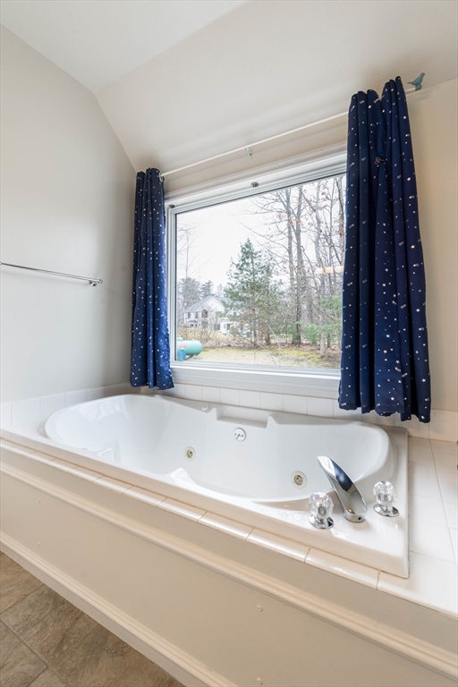11 Pope Road Atkinson, NH 03811 - Photo 27 of 42 a bathroom with a bathtub and a shower
