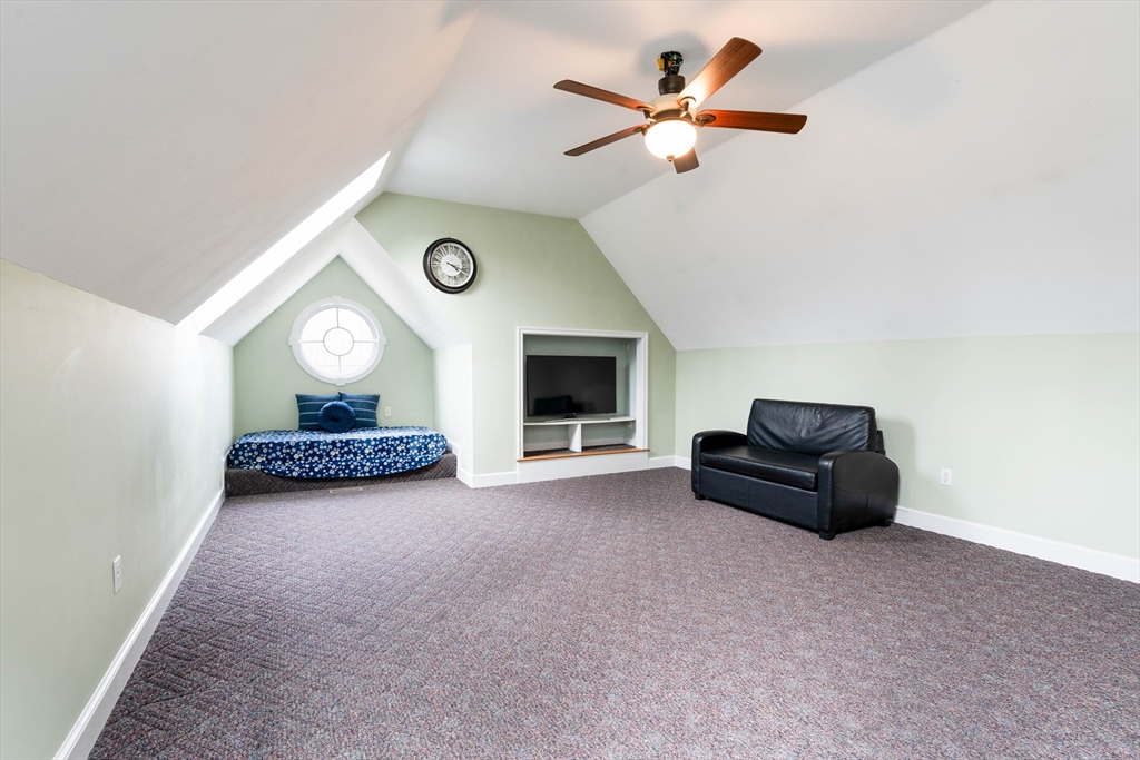 11 Pope Road Atkinson, NH 03811 - Photo 31 of 42 a living room with furniture and a fireplace