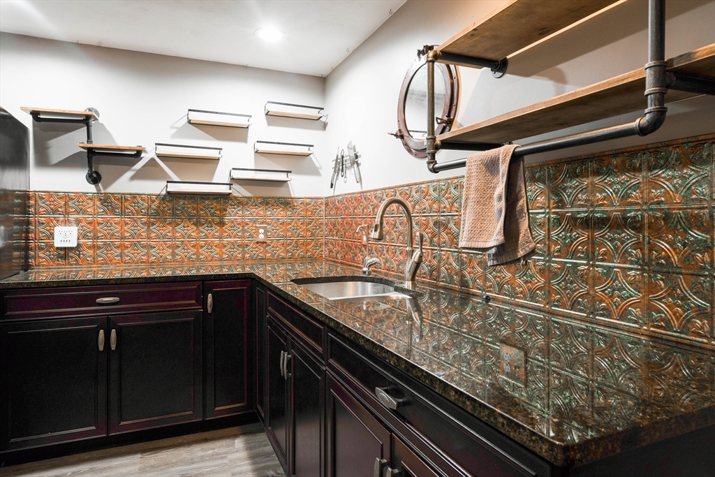 11 Pope Road Atkinson, NH 03811 - Photo 40 of 42 a kitchen with counter top space cabinetry and sink