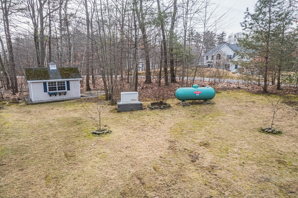11 Pope Road Atkinson, NH 03811 - Photo 7 of 42 a backyard of a house with table and chairs