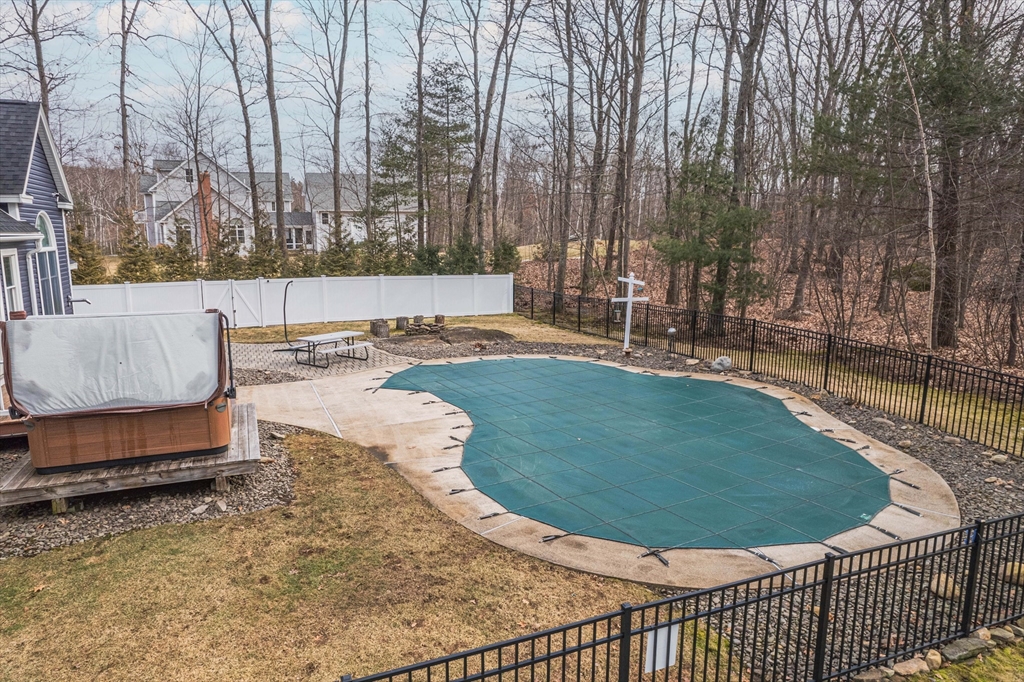 11 Pope Road Atkinson, NH 03811 - Photo 8 of 42 a view of a swimming pool with a sitting area