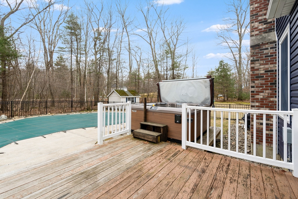11 Pope Road Atkinson, NH 03811 - Photo 9 of 42 a view of a wooden deck and a yard