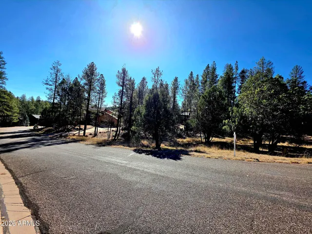 a view of a road with a building in the background
