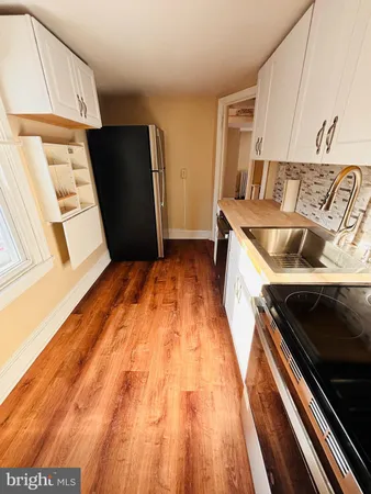 a view of appliances and cabinets