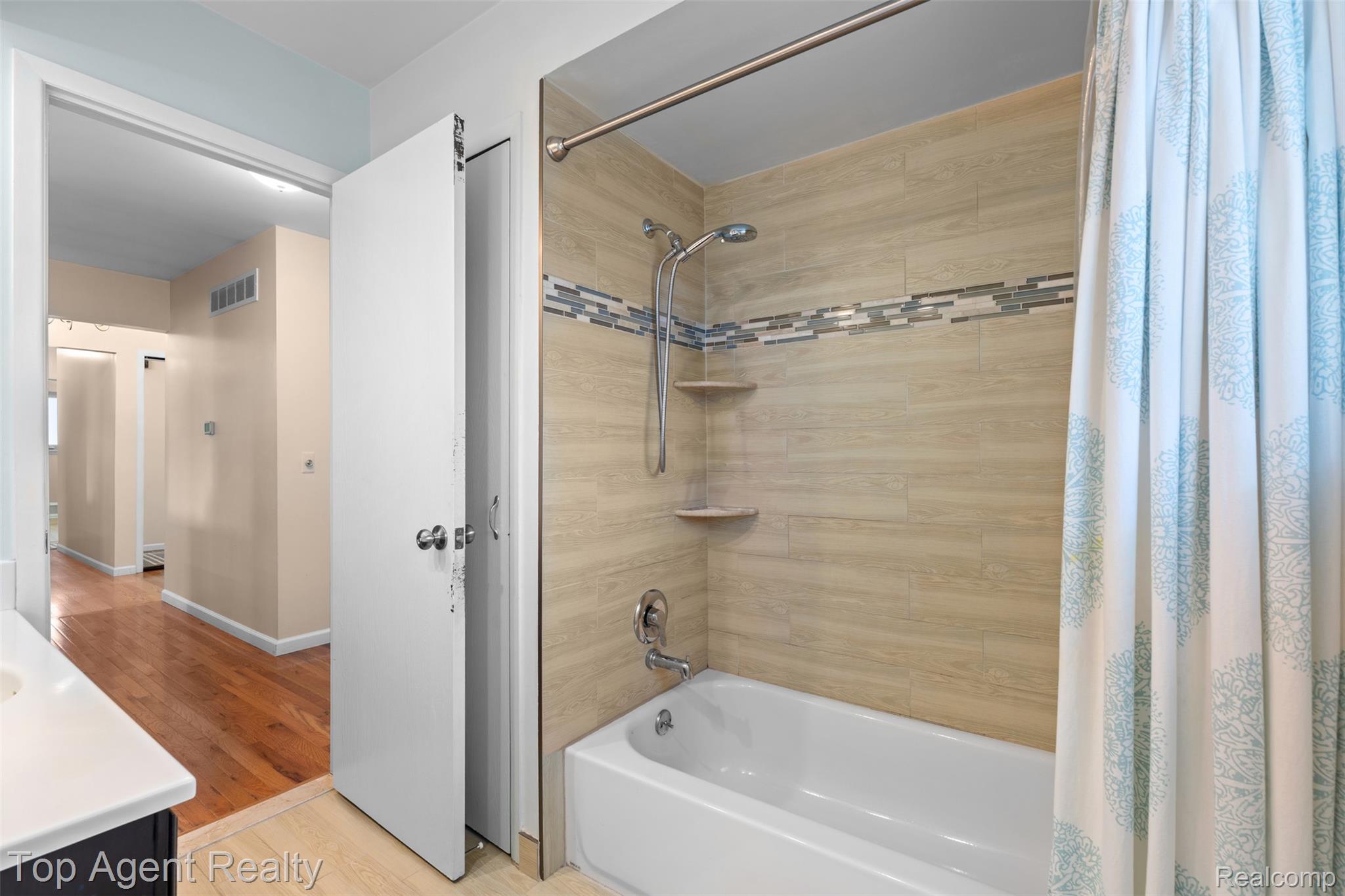 1351 Milverton Road Troy, MI 48083 - Photo 22 of 42 Full bathroom with shower / tub combo, light wood-type flooring, and vanity