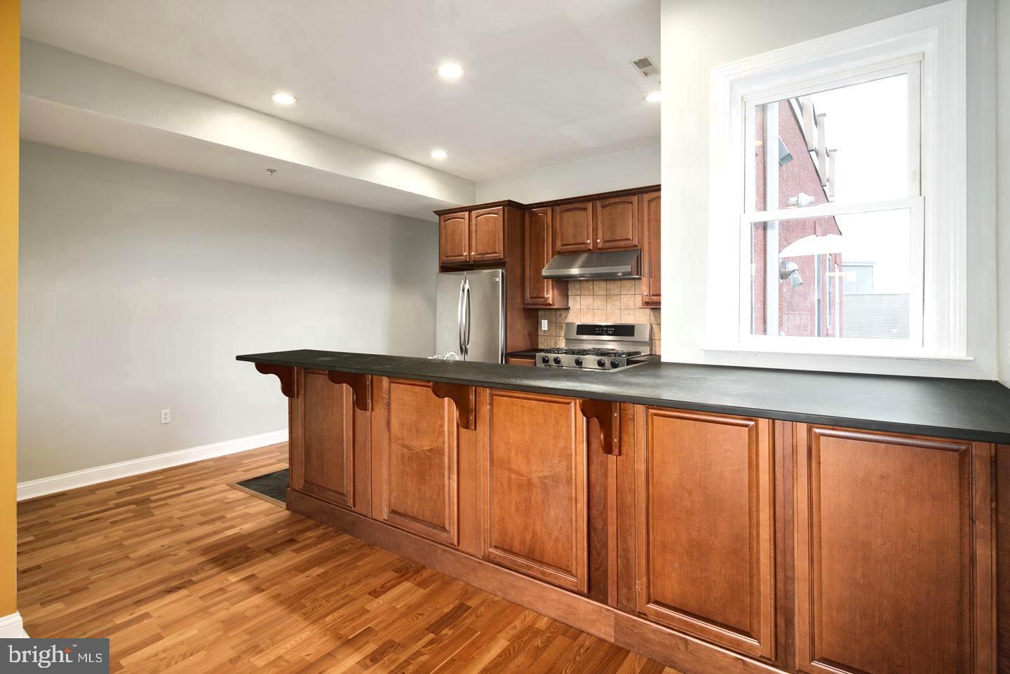 3933 Lancaster Avenue, Unit A Philadelphia, PA 19104 - Photo 8 of 22 a view of an empty room with a window