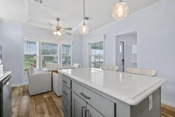 a kitchen with stainless steel appliances kitchen island granite countertop a sink and cabinets