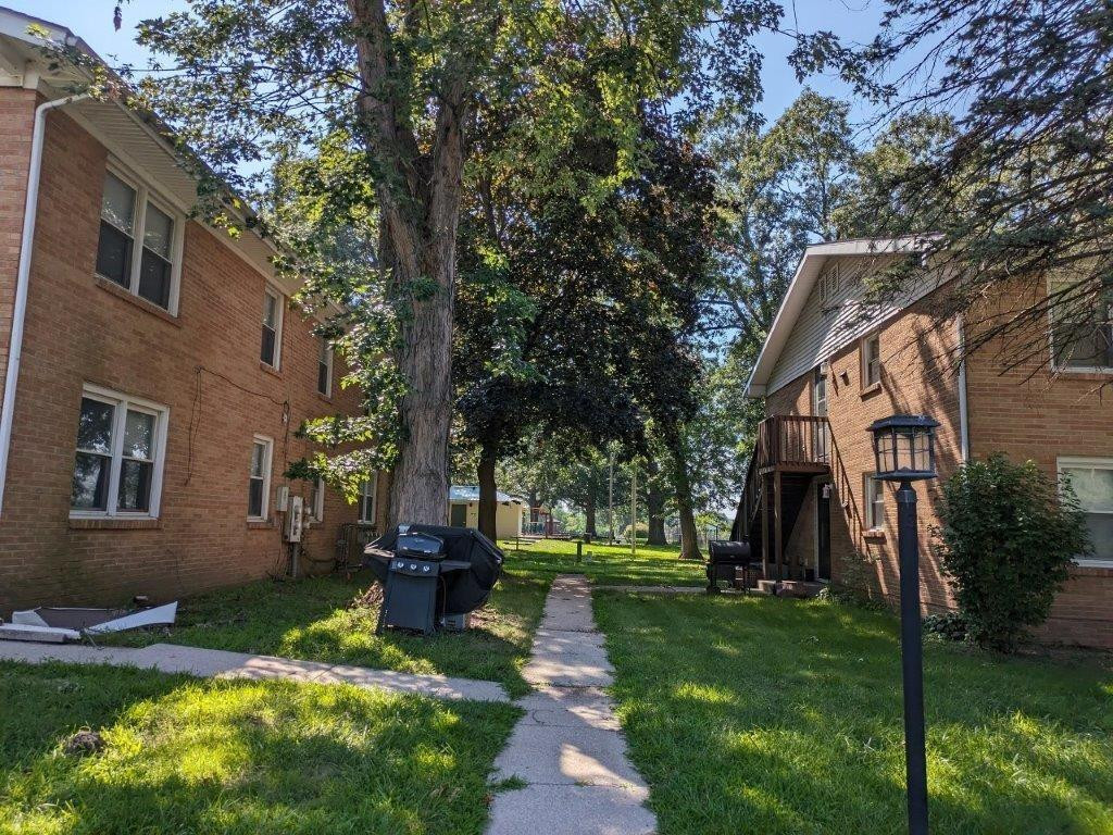 812 West Daumer Road, Unit C3 Kouts, IN 46347 - Photo 2 of 16 a front view of a house with garden