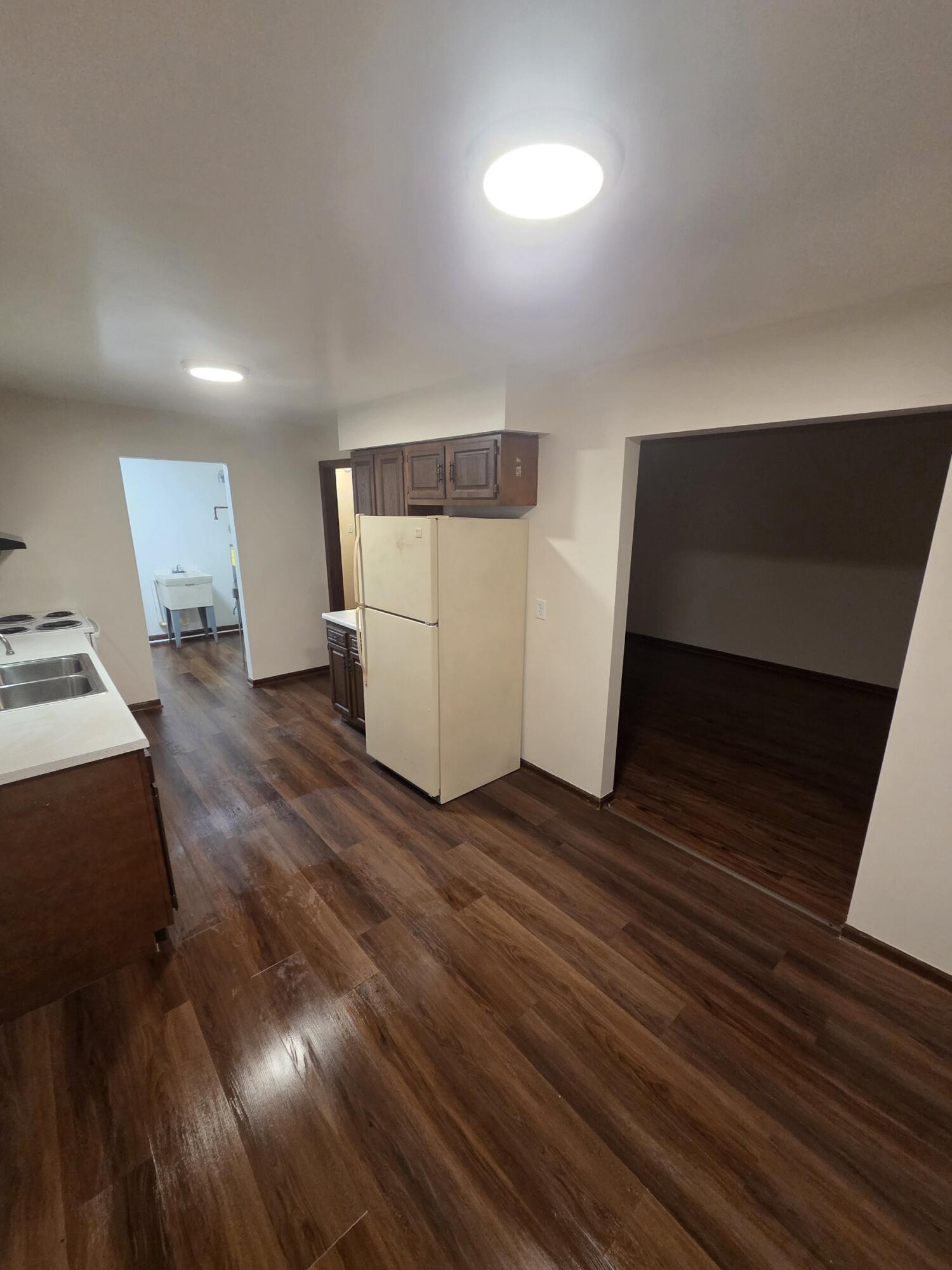 812 West Daumer Road, Unit C3 Kouts, IN 46347 - Photo 5 of 16 a view of a livingroom with wooden floor