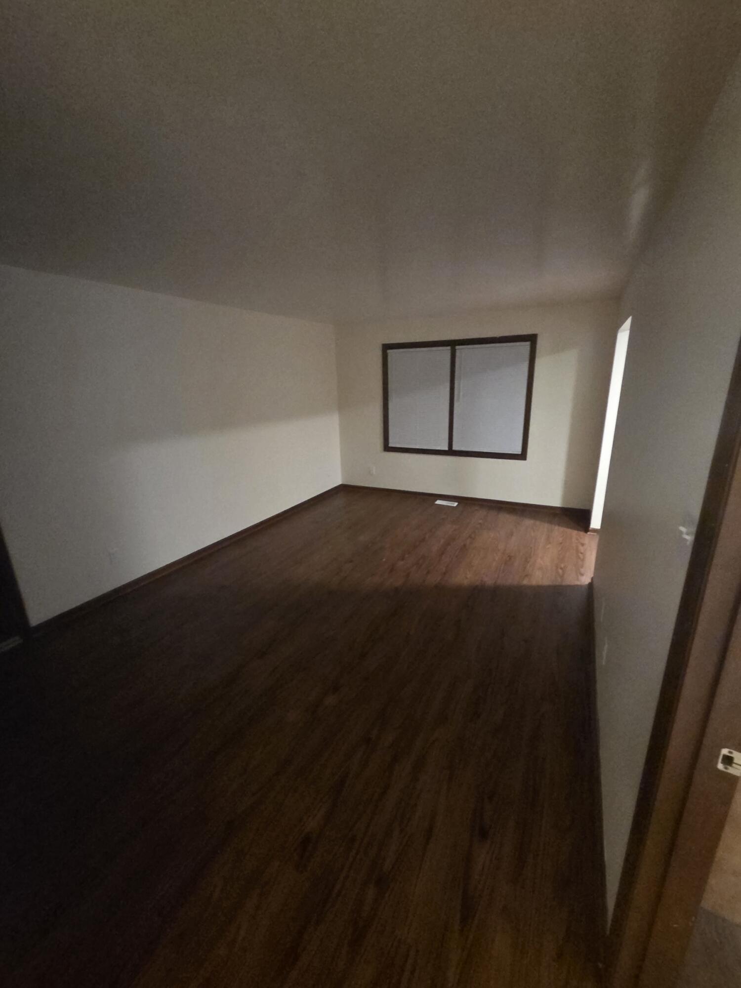 812 West Daumer Road, Unit C3 Kouts, IN 46347 - Photo 9 of 16 a view of an empty room and wooden floor