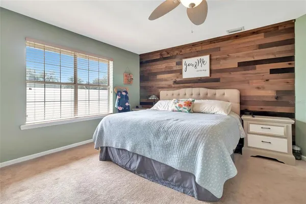 a bedroom with a bed and window