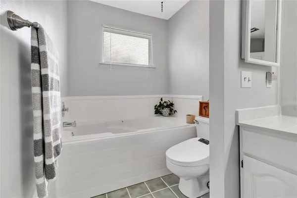 a bathroom with a toilet sink and bathtub