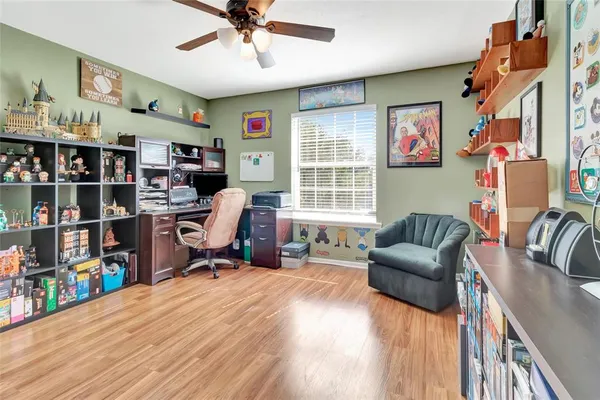 a workspace with furniture window and book shelf