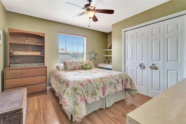 a bedroom with a bed and closet