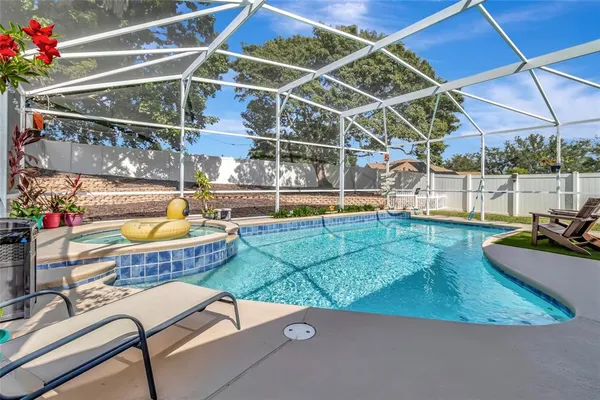 a view of a chairs and table in the patio